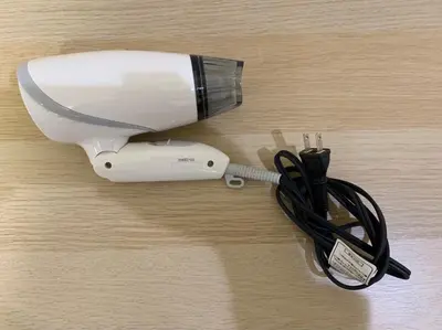 a hairdryer with a hair dryer at Tokyo Stay Nakano in Tokyo