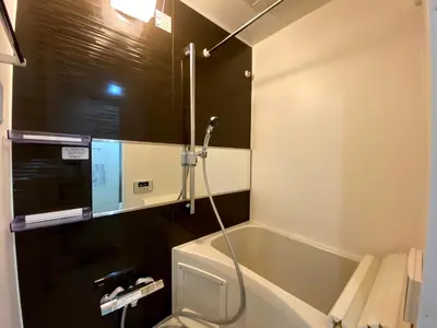 a bathroom with a shower and a bath tub at Belle harmonie togoshi101 in Tokyo