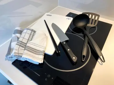 a table with some kitchen utensils on a counter at Belle harmonie togoshi101 in Tokyo