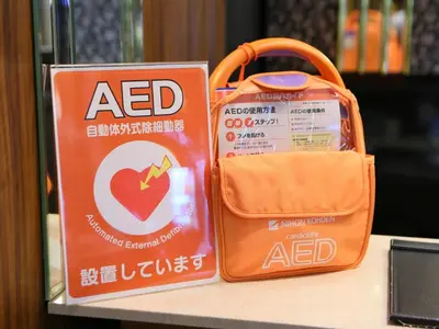 a bag of acid sitting on a table next to a purse at APA Hotel Ueno Hirokoji in Tokyo