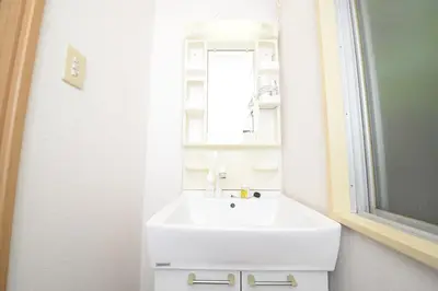 a bathroom with a white sink and a mirror at ACT Residence No.1 in Tokyo
