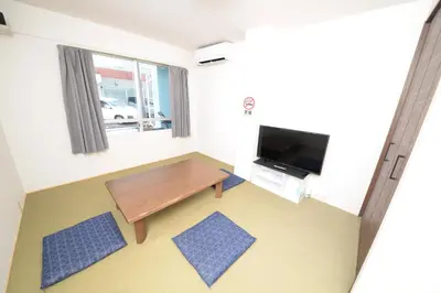 a small room with a table and a tv at ACT Residence No.1 in Tokyo