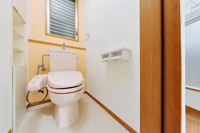 a bathroom with a white toilet and a window at Terrace Terano#201 in Tokyo