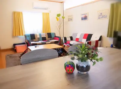 a living room with a table and a couch at Koto-ku - House / Vacation STAY 76385 in Tokyo