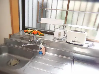 a kitchen counter with a sink and a window at Koto-ku - House / Vacation STAY 76385 in Tokyo