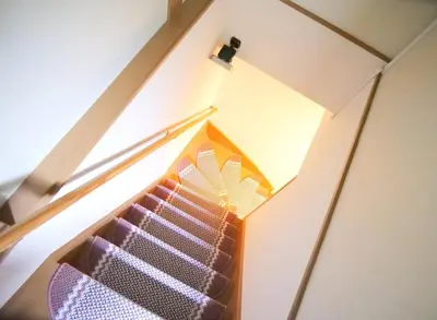 a room with a stair case with purple glass at Koto-ku - House / Vacation STAY 76385 in Tokyo