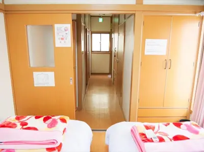 a room with two beds and a hallway at Koto-ku - House / Vacation STAY 76385 in Tokyo