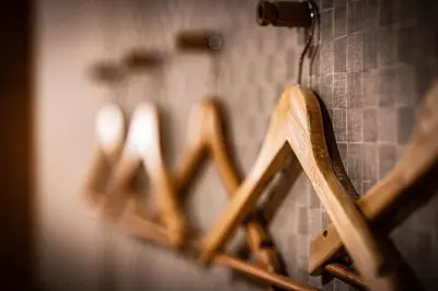 a row of wooden signs hanging on a wall at kaguya asakusa Women only guest house in Tokyo