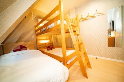 a bedroom with a bunk bed and a ladder at kaguya asakusa Women only guest house in Tokyo