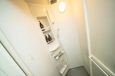 a small bathroom with a shower and a toilet at kaguya asakusa Women only guest house in Tokyo