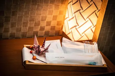 a wooden table with a box with a lamp on it at kaguya asakusa Women only guest house in Tokyo