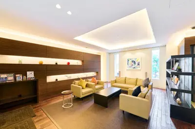 a living room with two couches and a table at Richmond Hotel Tokyo Shiba in Tokyo