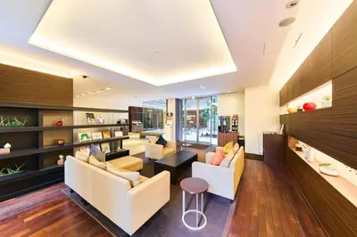 a living room with two couches and a table at Richmond Hotel Tokyo Shiba in Tokyo