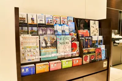 a display of books on a shelf in a store at Richmond Hotel Tokyo Shiba in Tokyo