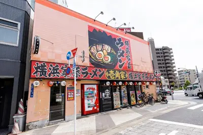 a building with a mural on the side of it at Re-Rent Residence \u62bc\u4e0a in Tokyo