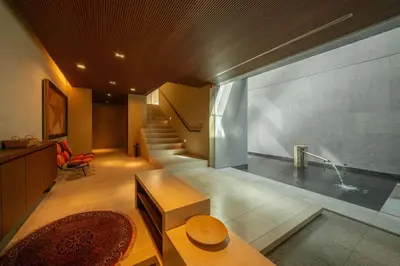 a living room with a staircase and a bath tub at Azabu Modern House The Tokyo Tower can be seen from the villa 500m2 in Tokyo