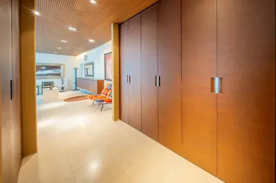 a hallway with wooden doors in a house at Azabu Modern House The Tokyo Tower can be seen from the villa 500m2 in Tokyo
