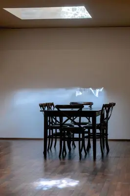 a table and two chairs in a room at Azabu Modern House The Tokyo Tower can be seen from the villa 500m2 in Tokyo