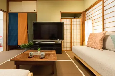 a living room with a couch and a flat screen tv at Shinjuku-ku - House / Vacation STAY 6644 in Tokyo