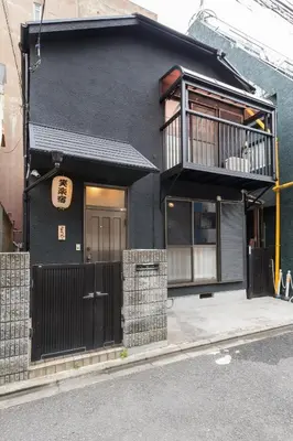 a black house with a balcony on a street at Shinjuku-ku - House / Vacation STAY 6644 in Tokyo