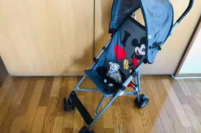 a blue baby stroller with stuffed animals in it at Elle's Shirokane Guest house in Tokyo