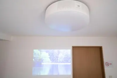 a window in a room with a door and a ceiling at Elle's Shirokane Guest house in Tokyo
