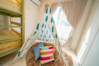 a childs room with a teepee in a bunk bed at Tachibana in Tokyo