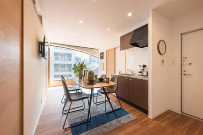 a kitchen and dining room with a table and chairs at TORA HOTEL Tokyo Skytree \u5bc5\u30db\u30c6\u30eb \u30b9\u30ab\u30a4\u30c4\u30ea\u30fcC in Tokyo
