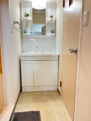 a small bathroom with a sink and a mirror at SAKURA INN Asakusa station walking 4 Min Shinjuku Shibuya Ginza Oshiage in Tokyo