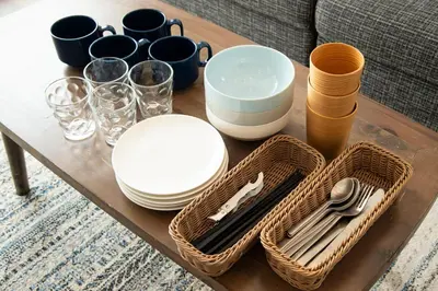 a table with plates and cups and utensils on it at GIVE Higashi Nakano in Tokyo