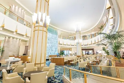 a restaurant with tables and chairs in a building at Tobu Hotel Levant Tokyo in Tokyo