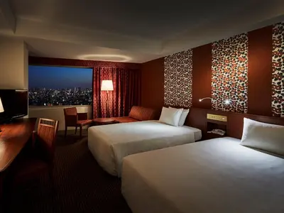 a hotel room with two beds and a desk at Tobu Hotel Levant Tokyo in Tokyo