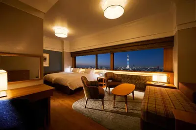 a hotel room with a bed and a table and chairs at Tobu Hotel Levant Tokyo in Tokyo