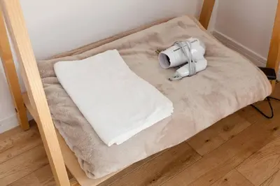 a bed with a pillow on top of it at Dwell Urban 6C in Tokyo