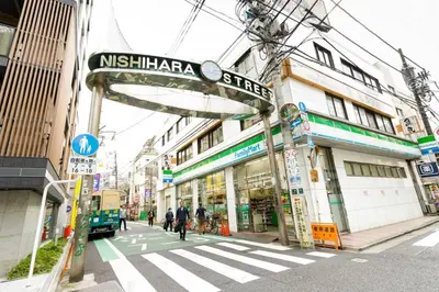 a street sign on a city street with buildings at Dwell Urban 4C in Tokyo