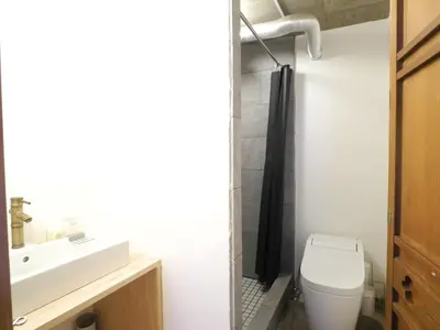 a bathroom with a toilet and a sink at Shibuya神宮前 DAICHI&SOTEN in Tokyo