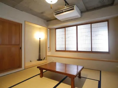a living room with a table and a window at Shibuya神宮前 DAICHI&SOTEN in Tokyo