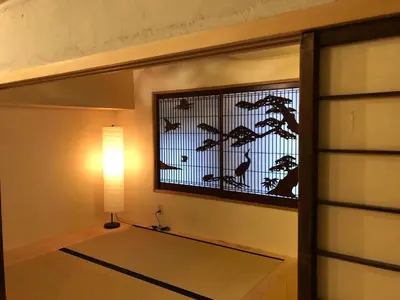 a room with a window with birds on it at Shibuya神宮前 DAICHI&SOTEN in Tokyo
