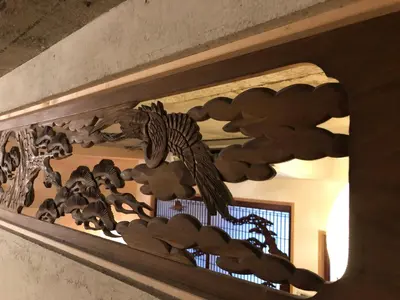 a wooden sculpture of animals on a wall at Shibuya神宮前 DAICHI&SOTEN in Tokyo