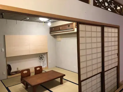 a room with a table and chairs and a room with a window at Shibuya神宮前 DAICHI&SOTEN in Tokyo
