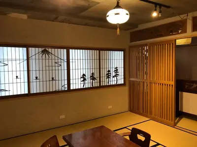 a dining room with a table and some windows at Shibuya神宮前 DAICHI&SOTEN in Tokyo