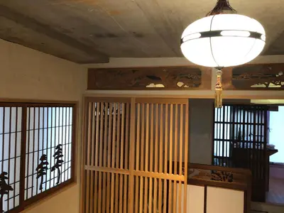 a room with two windows and a door with a light fixture at Shibuya神宮前 DAICHI&SOTEN in Tokyo