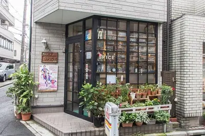 a store with plants in the front of a building at Dwell Urban 2B in Tokyo
