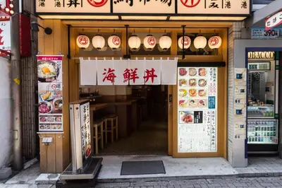 an entrance to a restaurant with signs on it at Dwell Urban 7D in Tokyo