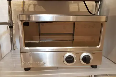 a stainless steel toaster oven in a kitchen at CuteFamilyHouse! 3LDK 6minShinjuku 3minJRsta Cozy,Fun,Bright! KidsFree Under6yrs in Tokyo