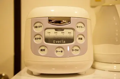 a white soap dispenser sitting on a counter at Akasaka Koyu Building 801 in Tokyo