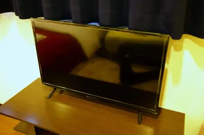 a television sitting on top of a wooden table at Akasaka Koyu Building 801 in Tokyo