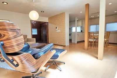 a dining room and living room with a table and chairs at Villa Shibuya in Tokyo