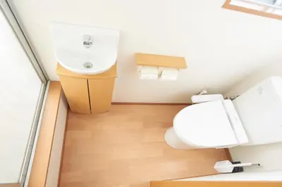 a bathroom with a toilet and a sink at Villa Shibuya in Tokyo