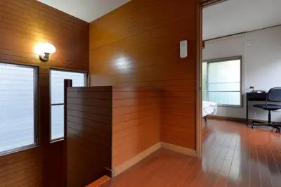 an office with wood paneled walls and a desk at Annex Shibuya in Tokyo